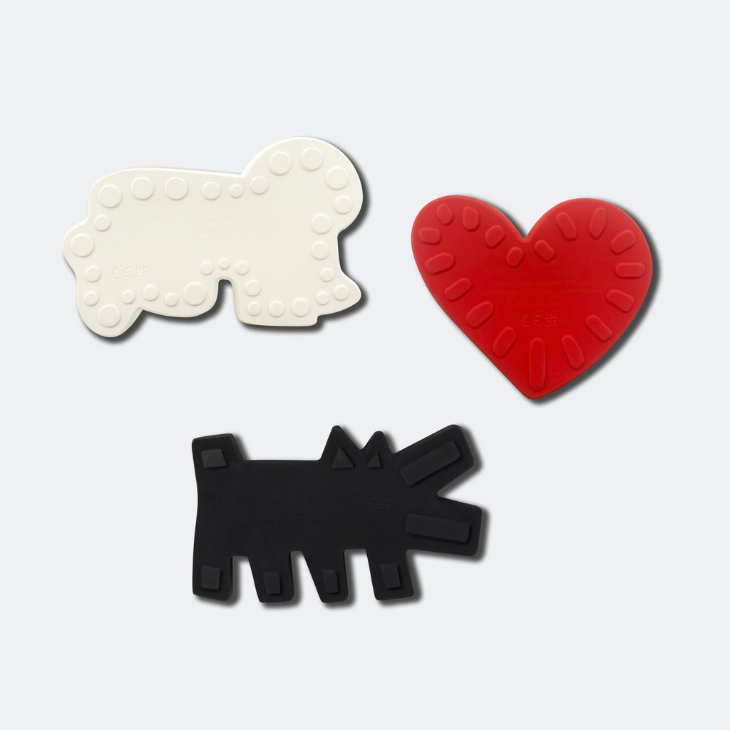 the reverse of the natural rubber Keith Haring bath toys showing raised ridges